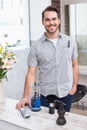 Handsome hair stylist smiling at camera Royalty Free Stock Photo
