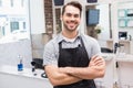 Handsome hair stylist smiling at camera