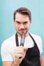 Handsome hair stylist smiling at camera Royalty Free Stock Photo
