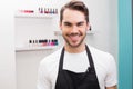 Handsome hair stylist smiling at camera Royalty Free Stock Photo