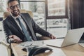 handsome happy businessman using speakerphone Royalty Free Stock Photo