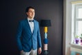 Handsome happy groom before wedding, preparing for wedding day