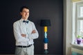 Handsome happy groom before wedding, preparing for wedding day