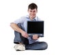 Handsome, happy man holding computer monitor Royalty Free Stock Photo