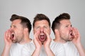 Handsome happy man shouting loudly, isolated on grey background Royalty Free Stock Photo