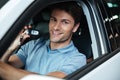 Handsome happy man sitting in his new car Royalty Free Stock Photo