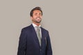 Handsome happy man in suit posing for company corporate business portrait relaxed and confident smiling happy isolated on grey as