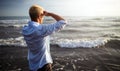 Handsome happy man wearing white shirt at the sea or the ocean background Royalty Free Stock Photo