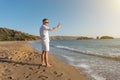 Handsome happy man in white shirt taking selfie on the beach. Summer vacations concept Royalty Free Stock Photo