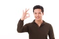 Handsome, happy, smiling man giving ok hand sign Royalty Free Stock Photo