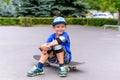 Handsome happy young boy on his skateboard Royalty Free Stock Photo