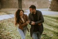 Happy young couple walking in autumn park Royalty Free Stock Photo