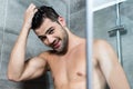 Young man taking shower Royalty Free Stock Photo