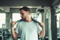 Handsome Healthy Man Holding Sweating Towel Exercised in Fitness Sport Club. Portrait of Strong Man Doing Exercising in Gym. Sport