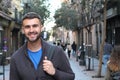 Handsome healthy man smiling in the city