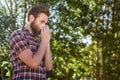 Handsome hipster blowing his nose Royalty Free Stock Photo