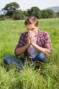 Handsome hipster blowing his nose Royalty Free Stock Photo