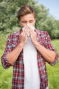 Handsome hipster blowing his nose Royalty Free Stock Photo