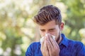 Handsome hipster blowing his nose Royalty Free Stock Photo