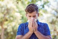 Handsome hipster blowing his nose Royalty Free Stock Photo