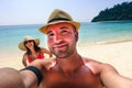 Handsome hipster couple making selfie on paradise beach Royalty Free Stock Photo