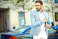 Handsome hipster man in suit in the street Royalty Free Stock Photo