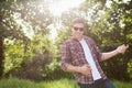 Handsome hipster playing air guitar Royalty Free Stock Photo