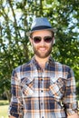 Handsome hipster smiling in the park Royalty Free Stock Photo