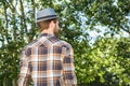 Handsome hipster walking in the park