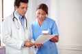 Handsome hispanic doctor working with nurse lady Royalty Free Stock Photo