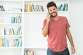 Handsome hispanic hipster man talking with girlfriend at mobile phone Royalty Free Stock Photo