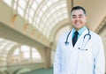 Handsome Hispanic Male Doctor or Nurse Inside Hospital Building Royalty Free Stock Photo
