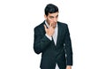 Handsome hispanic man wearing business clothes pointing to the eye watching you gesture, suspicious expression Royalty Free Stock Photo