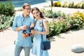 Handsome husband speaking to wife while walking together