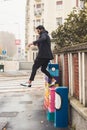 Handsome Indian man jumping in an urban context Royalty Free Stock Photo