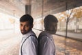 Handsome Indian man posing in an urban context Royalty Free Stock Photo