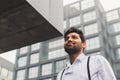 Handsome Indian man posing in an urban context Royalty Free Stock Photo