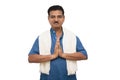 Handsome Indian man in traditional ware showing namaste gesture on isolated background. Royalty Free Stock Photo
