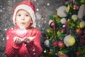 Handsome inspired boy holding a snowflake, winter season, snow