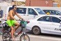 Handsome Israeli man riding a bike along the beach promanade of