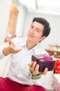 Handsome joyful young man holding Christmas Royalty Free Stock Photo