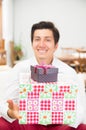 Handsome joyful young man holding Christmas Royalty Free Stock Photo