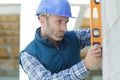 handsome laborer with level tool Royalty Free Stock Photo