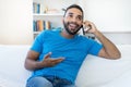 Handsome latin american hipster man with beard flirting at mobile phone