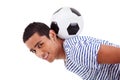 Handsome latin boy holding a soccer ball