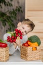 Handsome little boy in kitchen eating vegetables. Vegetarian. Healthy food Royalty Free Stock Photo