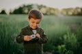 Handsome little boy with vintage retro camera. Kid as young photographer studying to take pictures. Hipster festive Royalty Free Stock Photo