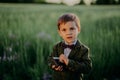 Handsome little boy with vintage retro camera. Kid as young photographer studying to take pictures. Hipster festive Royalty Free Stock Photo