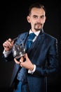 A handsome magician in a blue dress coat Royalty Free Stock Photo