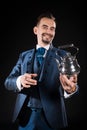 Handsome magician with a smile in a blue tailcoat Royalty Free Stock Photo